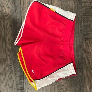 Coral Nike Dry-Fit running shorts. Size M.